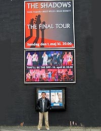 Warren at the front of one of the theatres. He took a photo of every front of house poster.